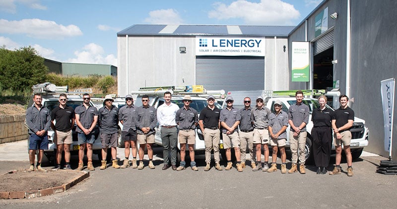 Lenergy team standing infront of the Lenergy Warehouse