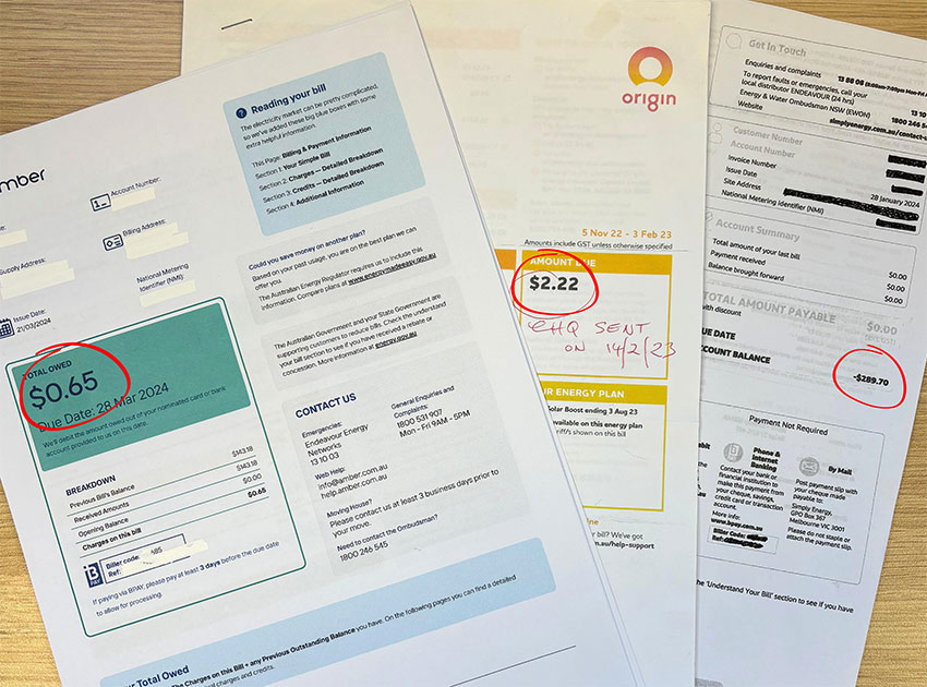 Electricity bills and energy plan documents spread on a table, highlighting costs and tariffs homeowners and renters pay for power usage.