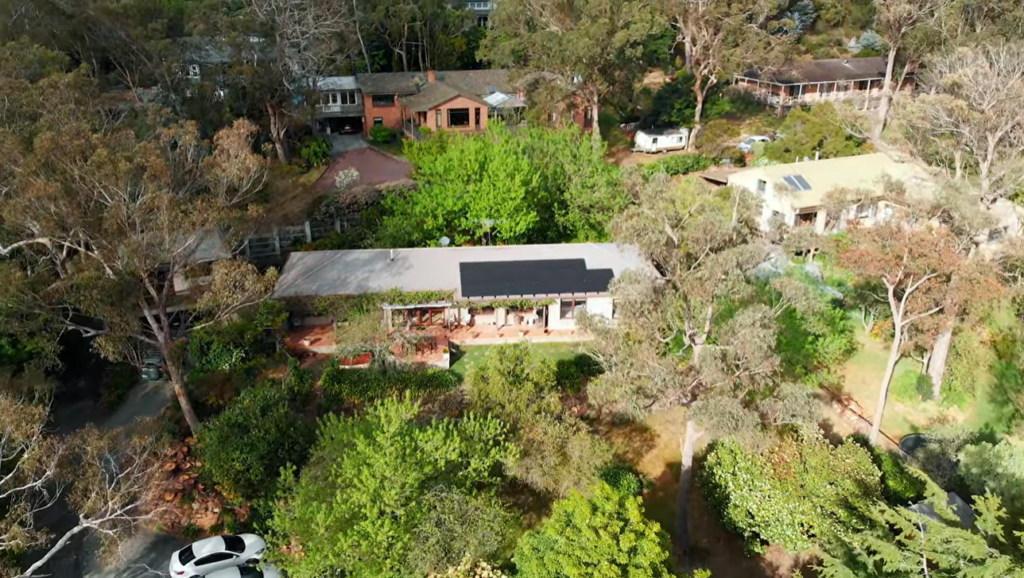 Aerial view of a home surrounded by trees in Mittagong, a typical Southern Highlands setting for a solar installation.